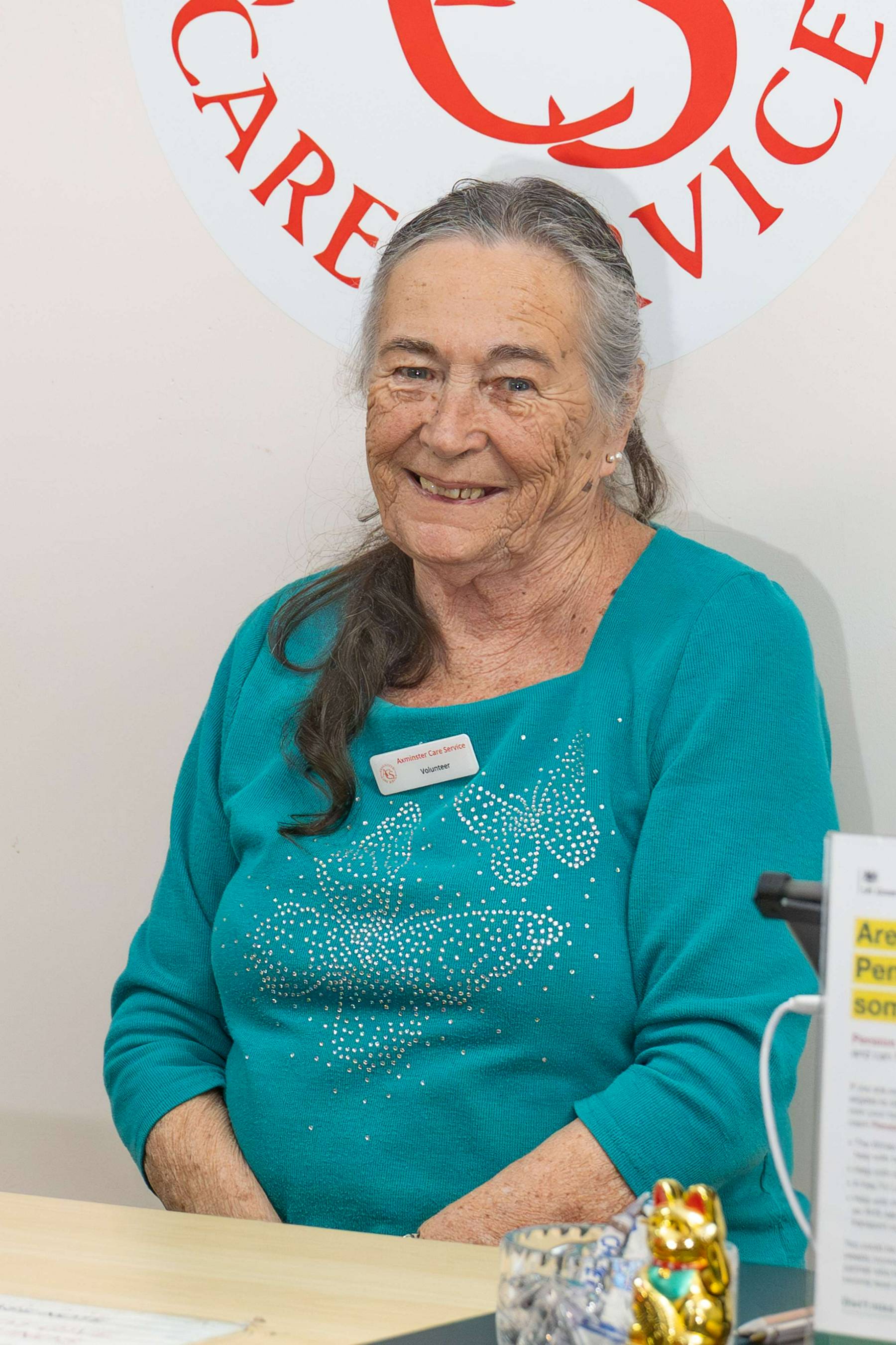 Shop attendant behind till